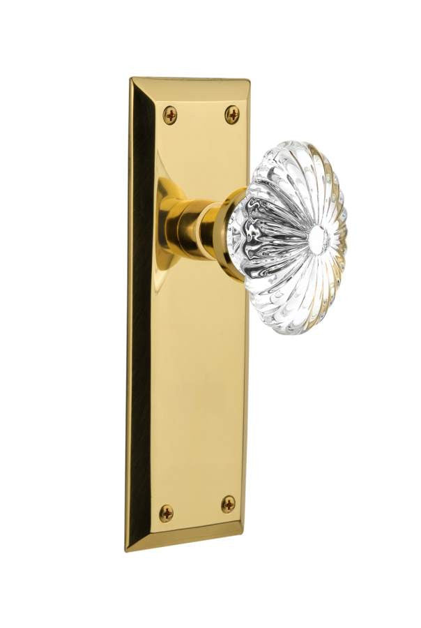 Nostalgic 712073: New York Backplate w/Oval Fluted Clear Glass Crystal Knob Privacy Door Set - Polished Brass