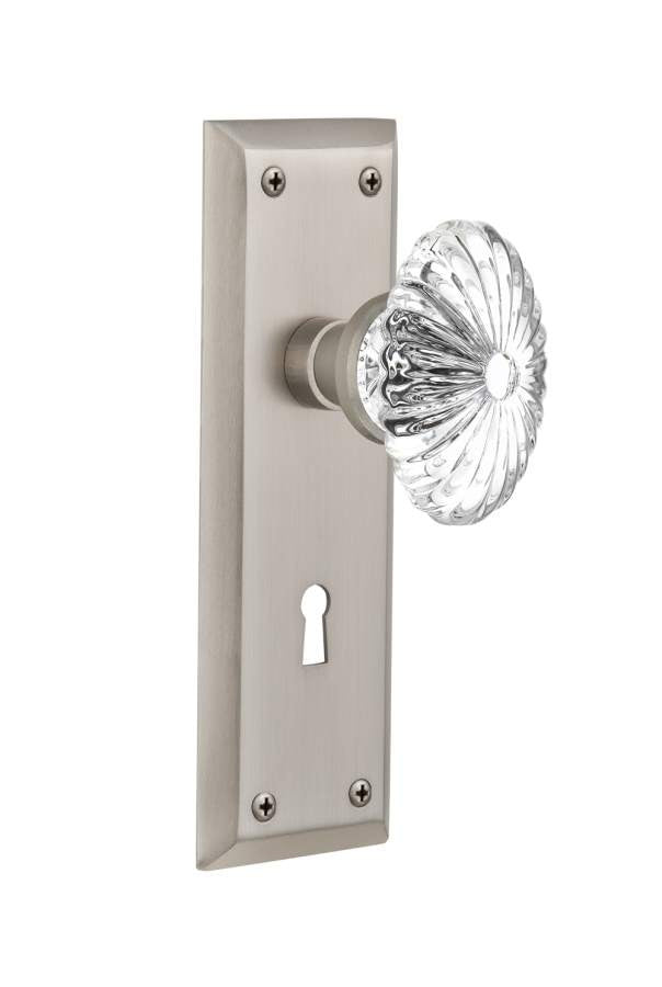 Nostalgic 711840: New York Backplate w/Oval Fluted Clear Glass Crystal Knob Passage Door Set - Satin Nickel