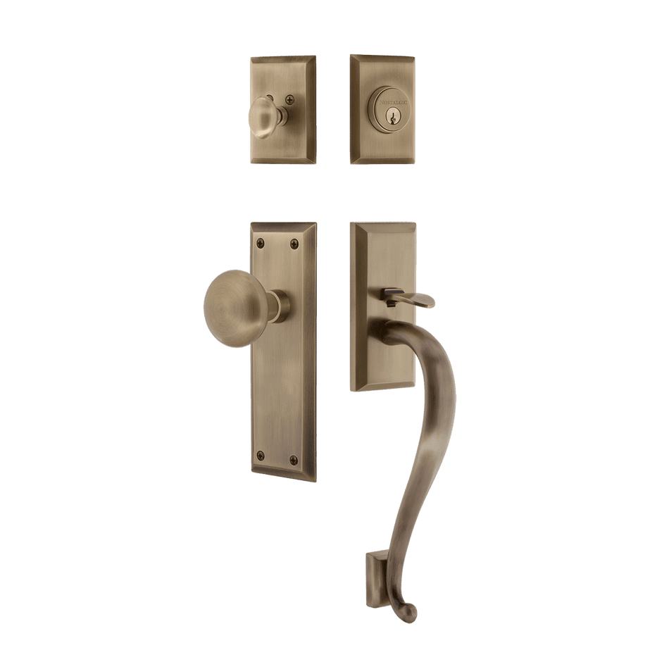 Nostalgic 719412: Entry Lockset w/New York Backplate, S-Grip Exterior Handle and New York Knob - Antique Brass