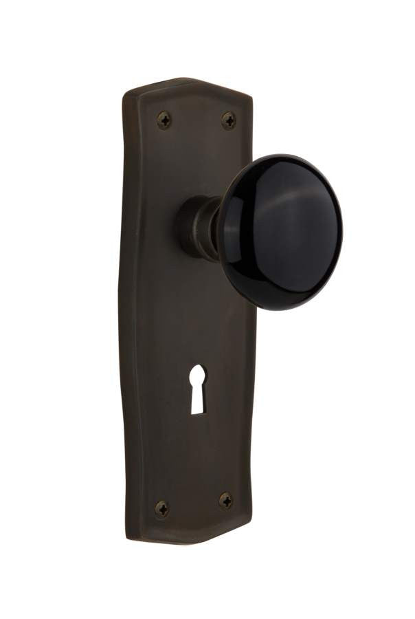 Nostalgic 710085: Prairie Backplate w/Black Porcelain Knob Passage Door Set - Oil-Rubbed Bronze
