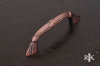RKI CP-854-DC: 3-1/2" cc Ornate Bow Cabinet Pull w/Lines & Crosses - Distressed Copper