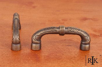 RKI CP-862-AE: 3" cc Bow Cabinet Pull w/Petals And Solid Line - Antique English