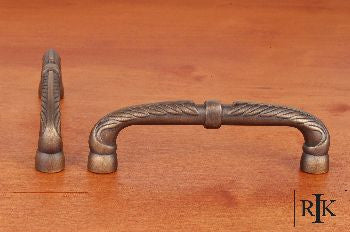 RKI CP-863-AE: 5" cc Bow Cabinet Pull w/Petals And Solid Line - Antique English