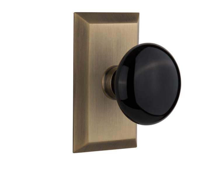 Nostalgic 713379: Studio Backplate w/Black Porcelain Knob Privacy Door Set - Antique Brass