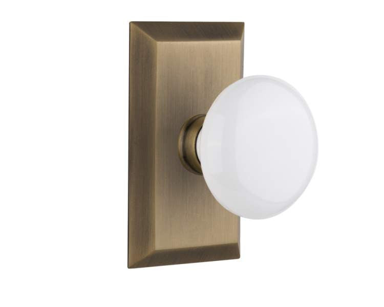 Nostalgic 713393: Studio Backplate w/White Porcelain Knob Privacy Door Set - Antique Brass