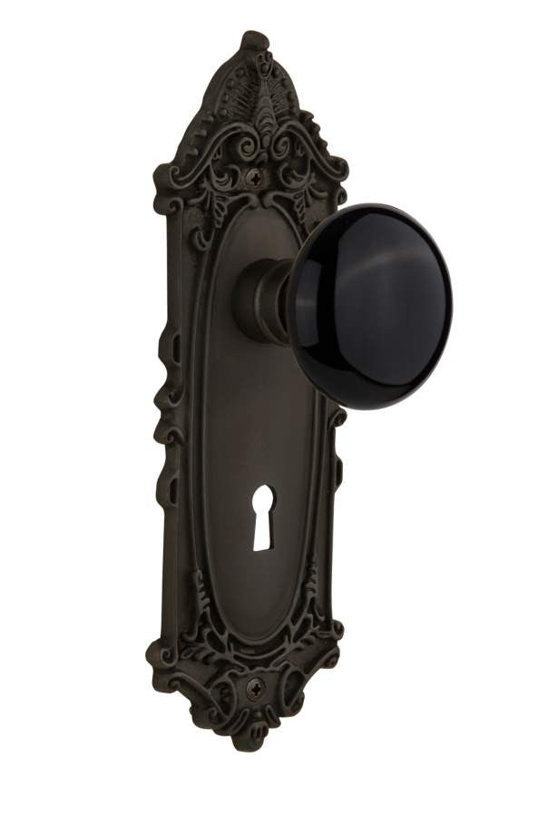 Nostalgic 710092: Victorian Backplate w/Black Porcelain Knob Passage Door Set - Oil-Rubbed Bronze