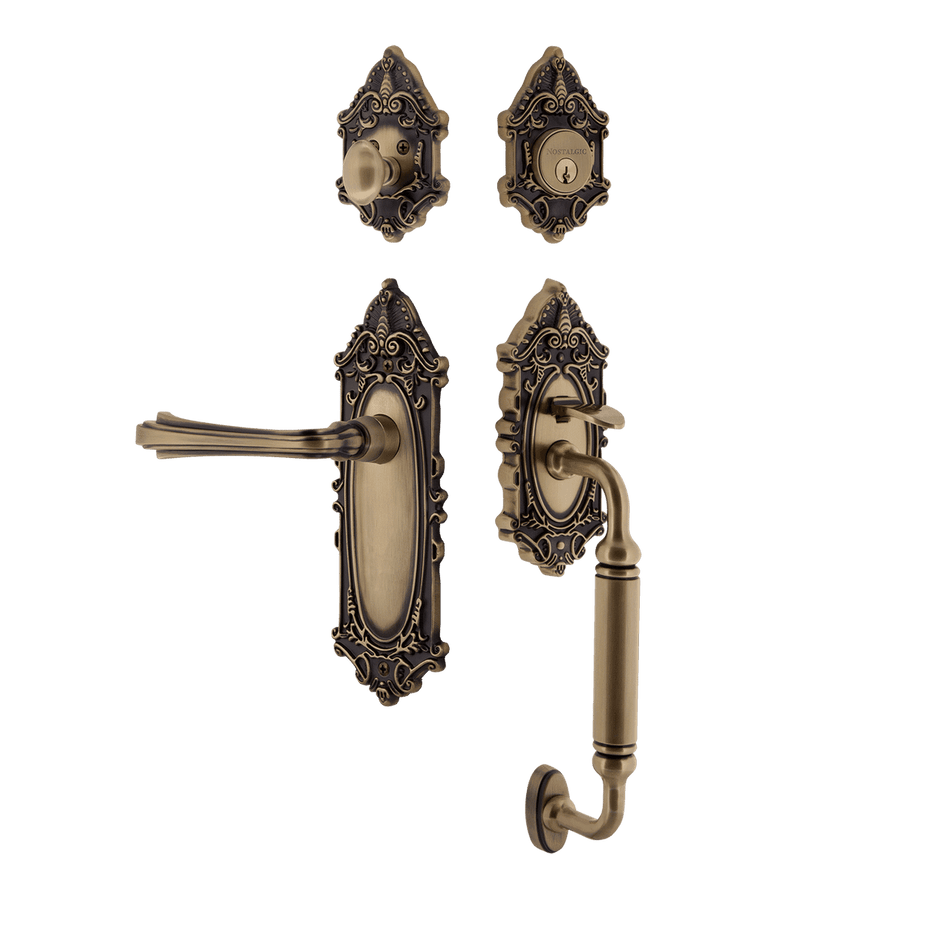 Nostalgic 771377: Entry Lockset w/Victorian Backplate, C-Grip Exterior Handle and Fleur Interior Lever - Antique Brass