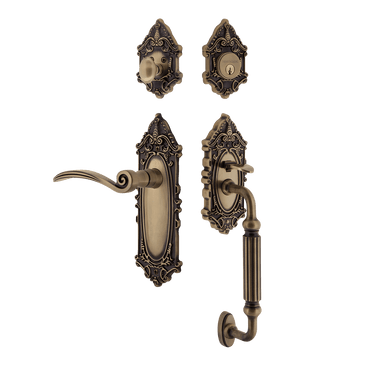 Nostalgic 771533: Entry Lockset w/Victorian Backplate, F-Grip Exterior Handle and Swan Interior Lever - Antique Brass