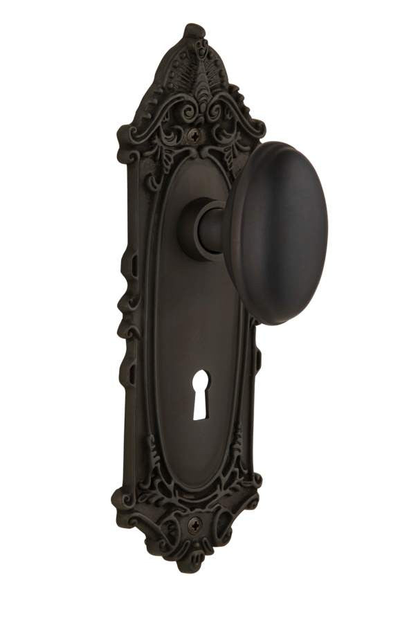 Nostalgic 704033: Victorian Backplate w/Homestead Knob Passage Door Set - Oil-Rubbed Bronze