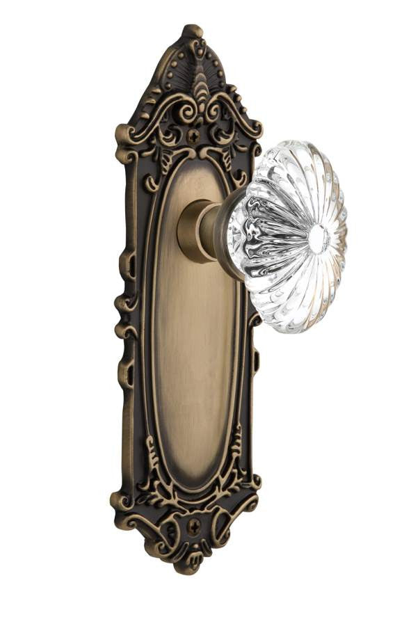 Nostalgic 712083: Victorian Backplate w/Oval Fluted Clear Glass Crystal Knob Privacy Door Set - Antique Brass