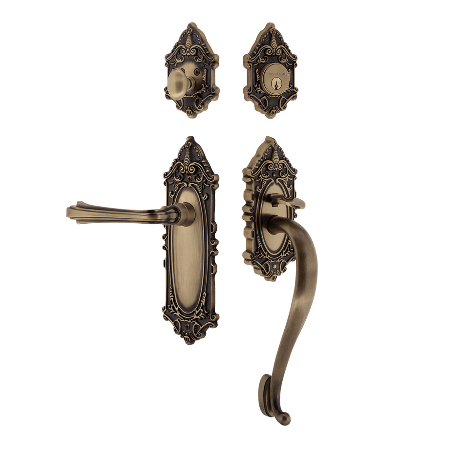 Nostalgic 769271: Entry Lockset w/Victorian Backplate, S-Grip Exterior Handle and Fleur Interior Lever - Antique Brass